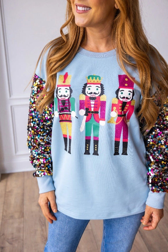 Nutcrackers On Blue Top with Sequin Sleeves